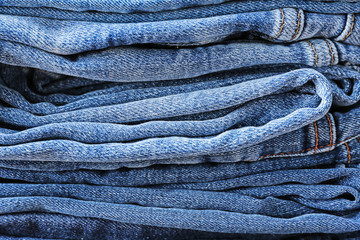 Stack of jeans clothes, closeup