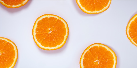 sliced orange on light blue background