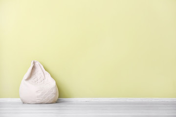 Comfortable beanbag near color wall