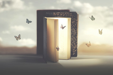 concept of freedom and fantasy of butterflies coming out of a mysterious book - obrazy, fototapety, plakaty