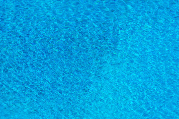 Fototapeta na wymiar Rippled water for background. Water surface in swimming pool.