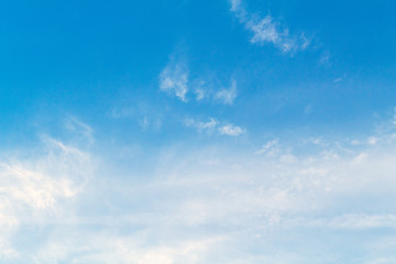 Naklejka na ściany i meble Blue sky with picturesque fluffy clouds background