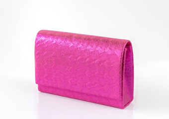 Magenta pink clutch isolated on white background