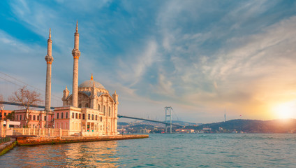 Fototapeta na wymiar Ortakoy mosque and Bosphorus bridge at amazing sunset - Istanbul, Turkey