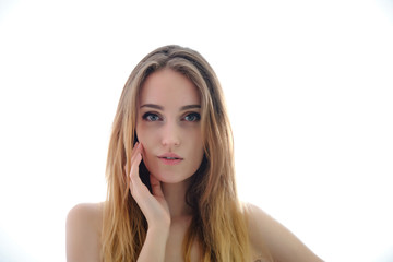 Photograph of a portrait of a beautiful fashionable beauty woman girl with long dark flowing hair, isolate on a white background. She is standing in different poses and smiling.