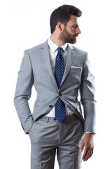 A young man wearing suit on a white background