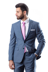 A young man wearing suit on a white background