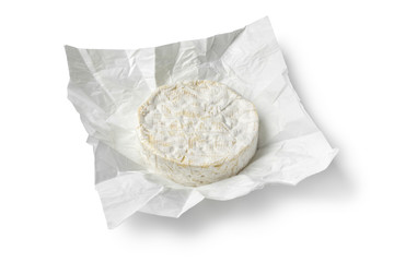 Fototapeta na wymiar Single whole round french Brie cheeseat package paper