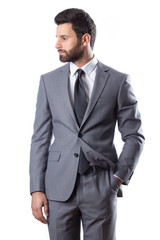 A young man wearing suit on a white background