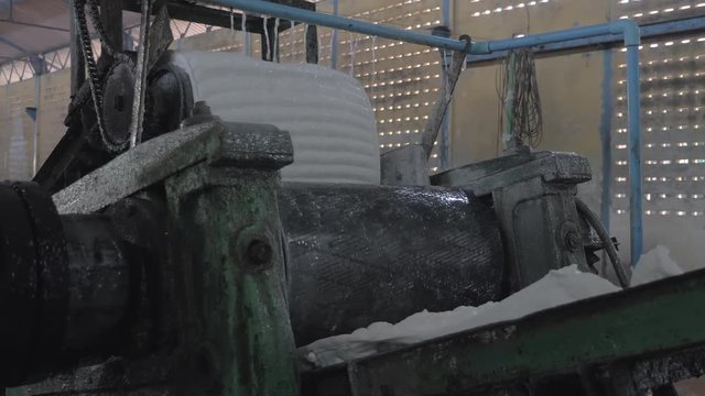 close up of  the coagulum is processed in a series of machine that crush and press the rubber. 
