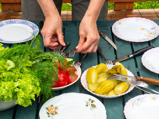 Fresh farmers tomatoes, cucumbers, dill, salad on green table. View from above