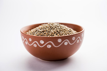 Pearl Millet or Bajra seeds also known as sorghum, in a bowl, selective focus