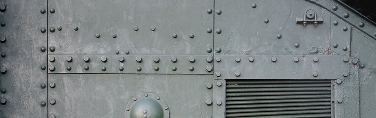 Abstract green industrial metal textured background with rivets and bolts