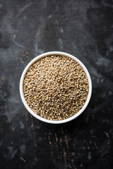 Pearl Millet or Bajra seeds also known as sorghum, in a bowl, selective focus