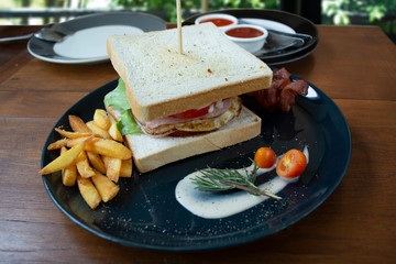 Club sandwich look so delicious ready to eat on wooden deak.