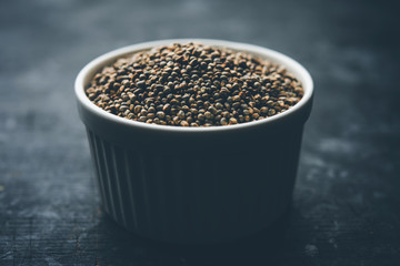 Pearl Millet or Bajra seeds also known as sorghum, in a bowl, selective focus