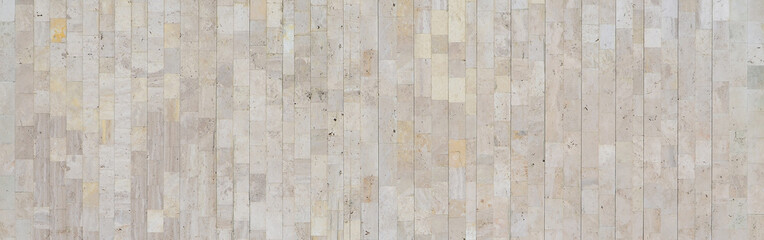 Background texture of old beige marble wall from a variety of large tiles