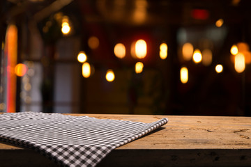Table background with napkin and blurred bar background space