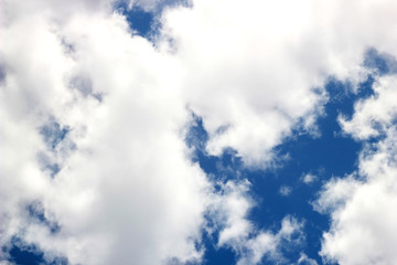 Blue sky background with clouds. Closeup view of texture blue sky and white clouds