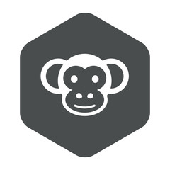 Icono plano cabeza de mono en hexágono color gris