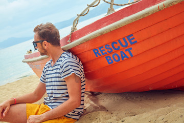 Rescue boat and lifeguard keeping the beach safe in summertime period.