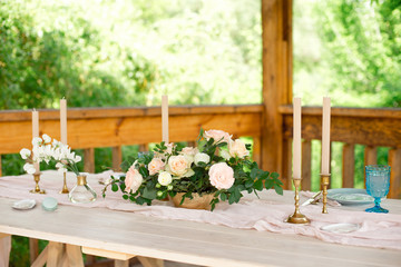 Fototapeta na wymiar Beautiful festive table setting with elegant white flowers and cutlery, dinner table decoration