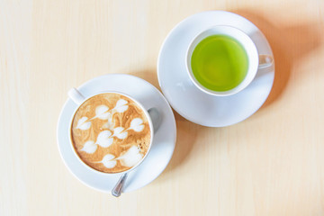 hot coffee on table / hot cappuccino with nice pattern milk foam 