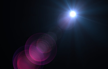 Lens flare light over black background.