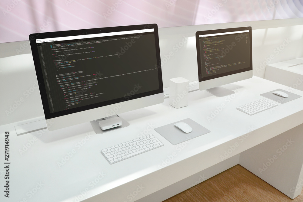 Aufkleber Developer's office. Two computer displays with code editors.