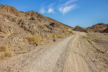 wasteland dry mountain scenery landscape and lonely trails through wilderness empty environment 