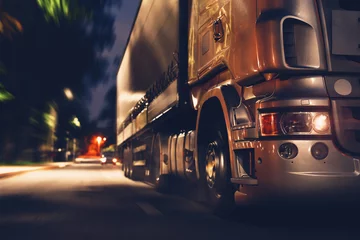 Tuinposter truck at night in selective focus © Oleksandr