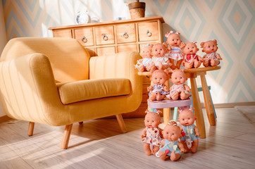 Group of cute baby dolls  on bright background