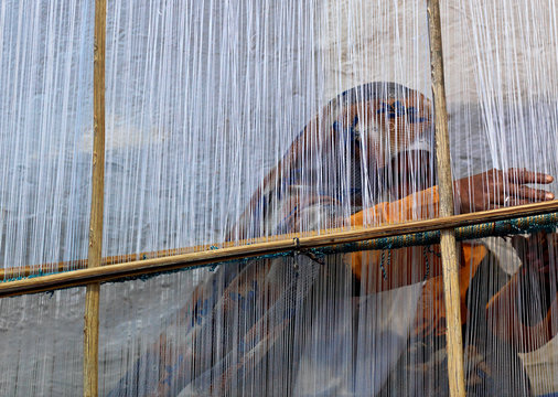 Woman making a carpet, Ghadames, Libya