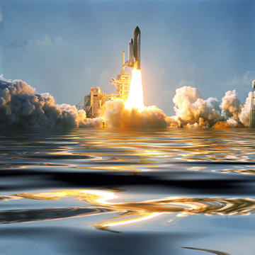 Water And Fascinating Liftoff Of The Rocket. Rocket Shuttle Spaceship Is Lifting From Earth. Elements Of Image Furnished By NASA.