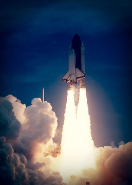 Spaceship launch in clouds. Rocket liftoff into space. The elements of this image furnished by NASA.