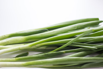 Fresh green onion on white background