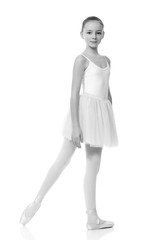 young girl ballerina posing on white background