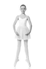 young girl ballerina posing on white background