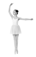 Fototapeta premium young girl ballerina posing on white background
