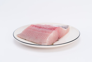Fillet of fish on white dish