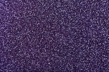 Fototapeta premium Dark purple sparkling background from small sequins, closeup. Brilliant backdrop.