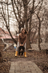 Fototapeta premium Bernese Mountain Dog puppy runs and jumps with kid