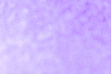 Blurred shiny lilac background with sparkling lights.