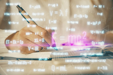 Science formula hologram over woman's hands taking notes background. Concept of study. Multi...