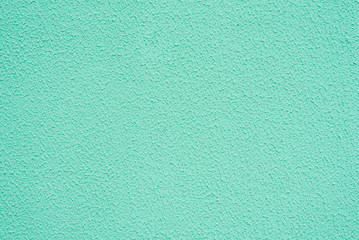 Bright light turquoise background. Abstract grunge decorative stucco wall texture. Wide rough background with copy space for text