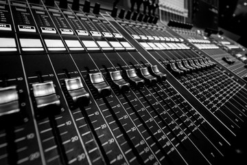 Closeup view of Faders on Professional Audio Digital Sound Mixing Control Console.
