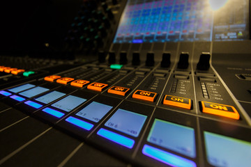 Closeup view of Faders on Professional Audio Digital Sound Mixing Control Console.