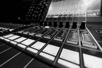 Closeup view of Faders on Professional Audio Digital Sound Mixing Control Console.