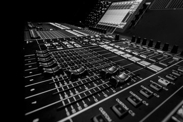 Closeup view of Faders on Professional Audio Digital Sound Mixing Control Console.