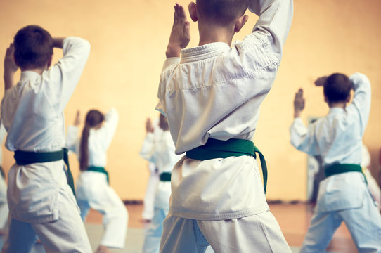 Kids training on karate-do. Banner with space for text. Retro style. For web pages or advertising printing. Photo without faces.